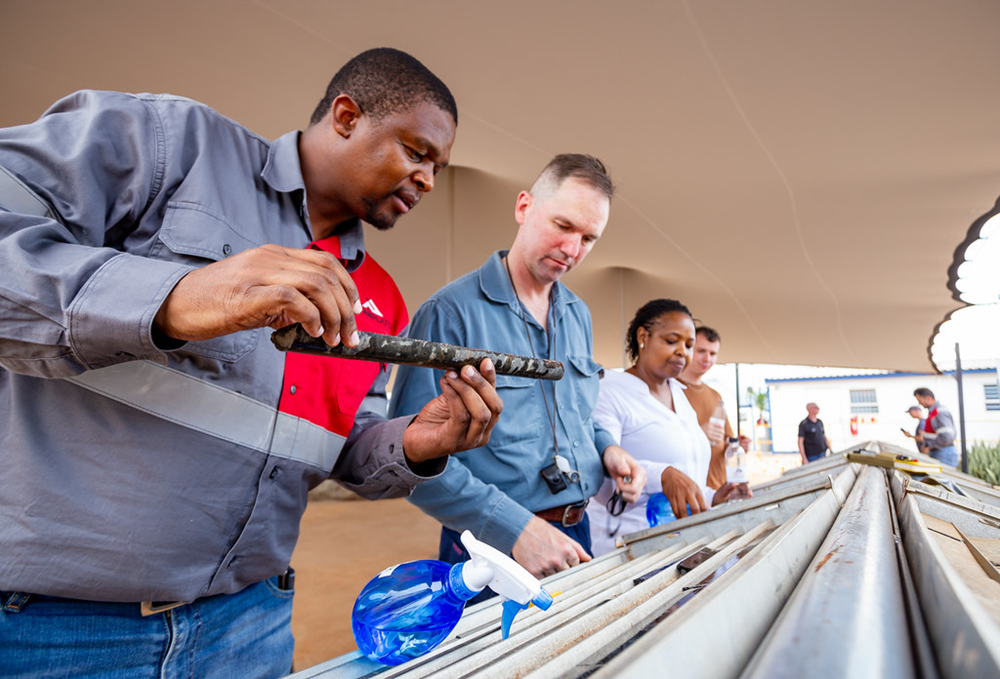 Justin Tolman examining core samples from the Platreef platinum-palladium-nickel mine in South Africa just ahead of first production after years of delineation and development.